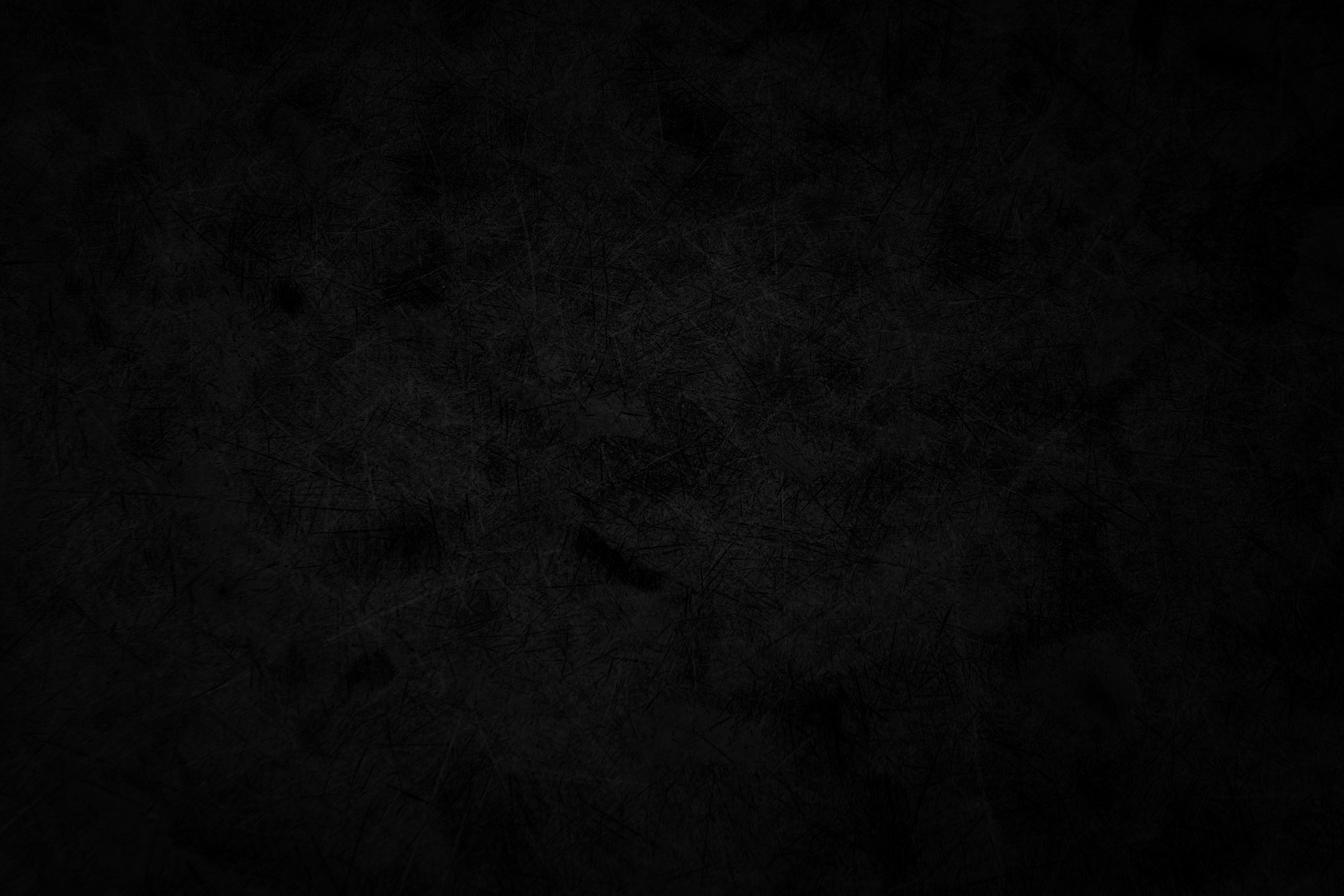 Black grunge metal wall background.